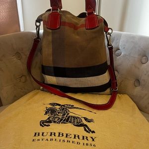 Burberry cross body has som damages on the  lower  corners